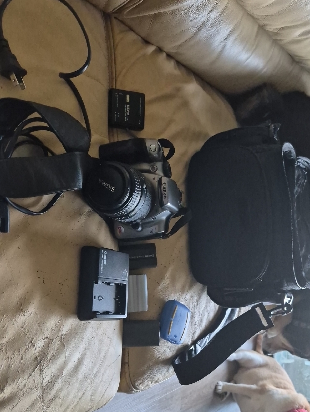 Canon Silver DSLR with Black Lens and Black Carrying Case
